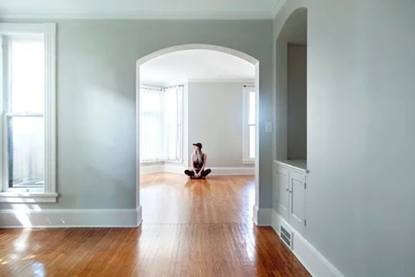 Person sitting in an empty home