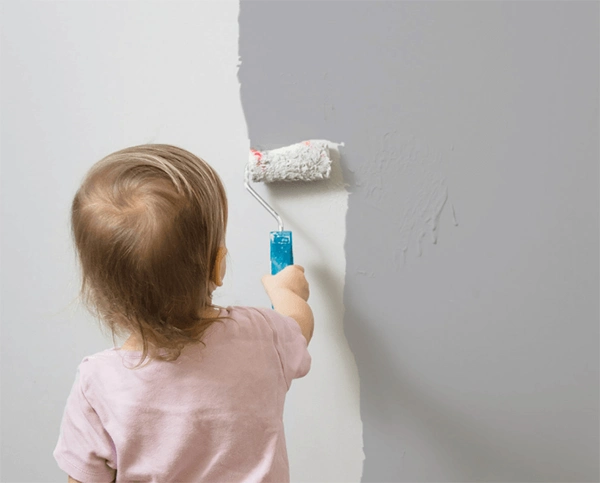 Child painting a wall