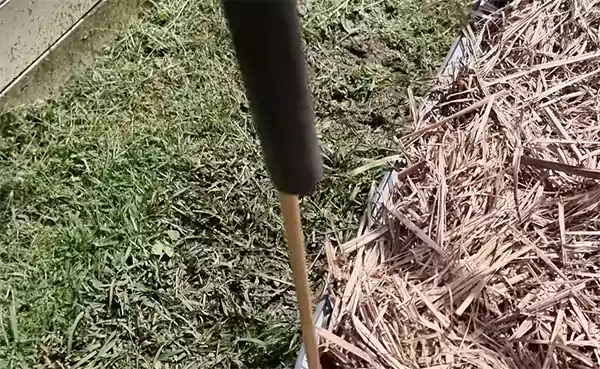 Putting one post inside one end of the poly pipe