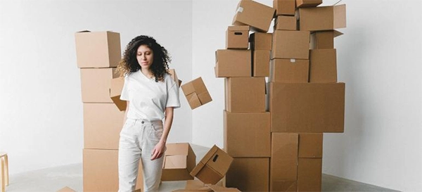 woman surrounded by boxes