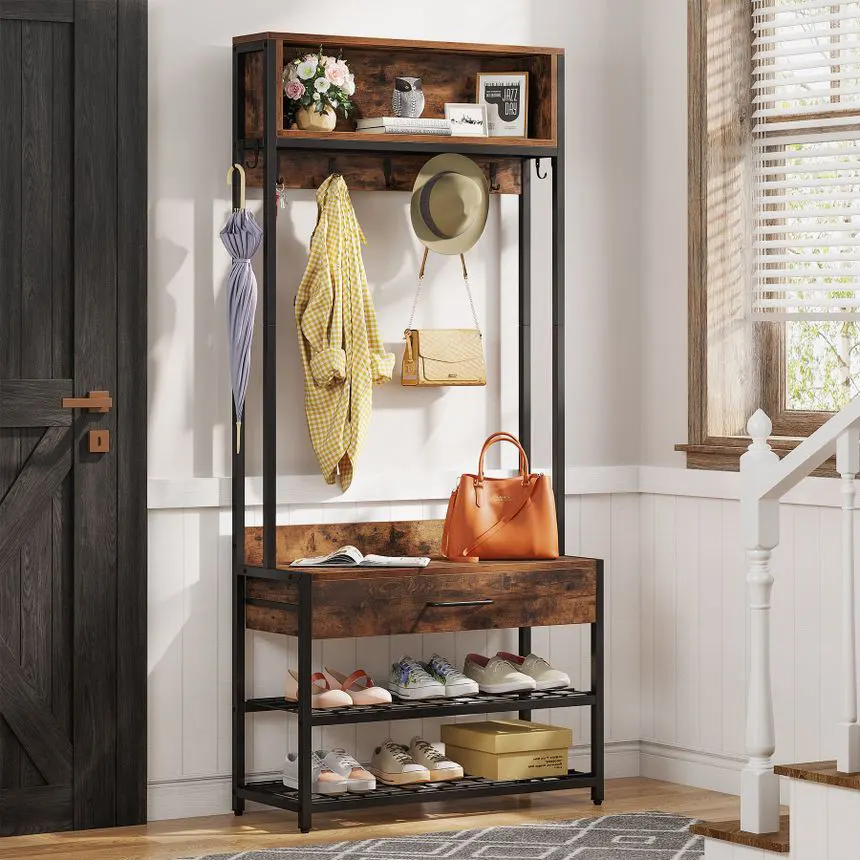 A small entryway with coat hooks, a shoe rack, and a tray for keys and mail