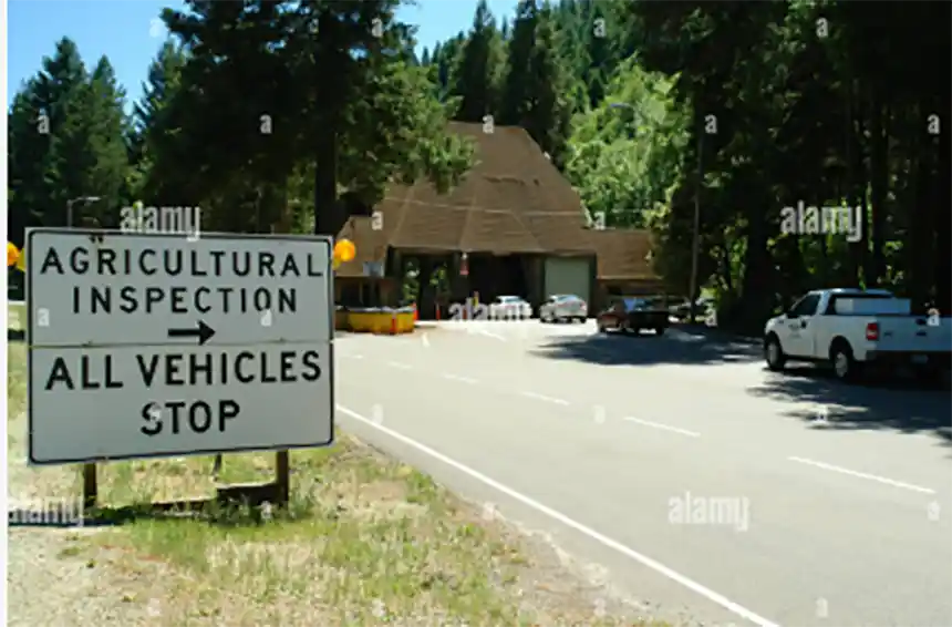 Highway agricultural inspection station sign at a state border crossing