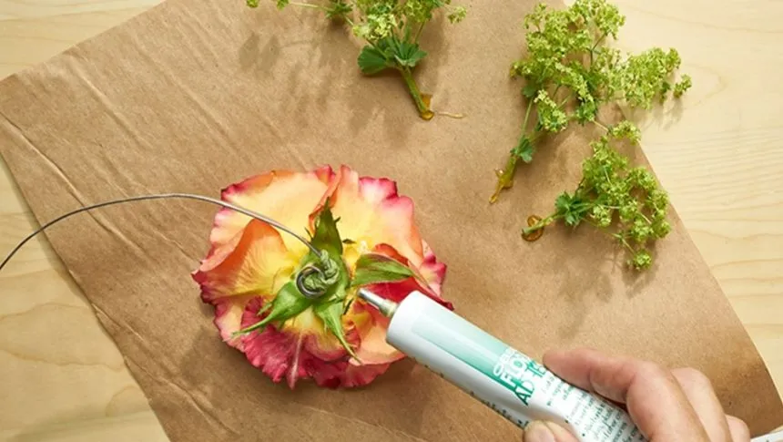 Applying glue to a flower