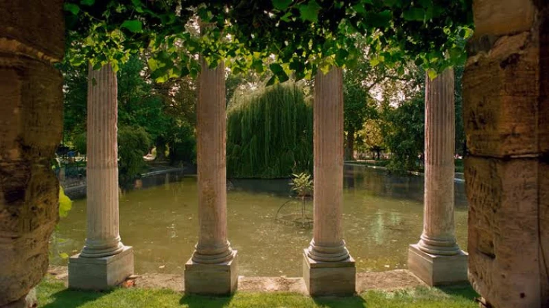 beautiful Greek garden with lush plants and stone