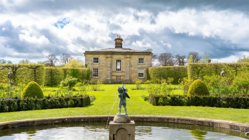 English landscape garden with colorful flower beds