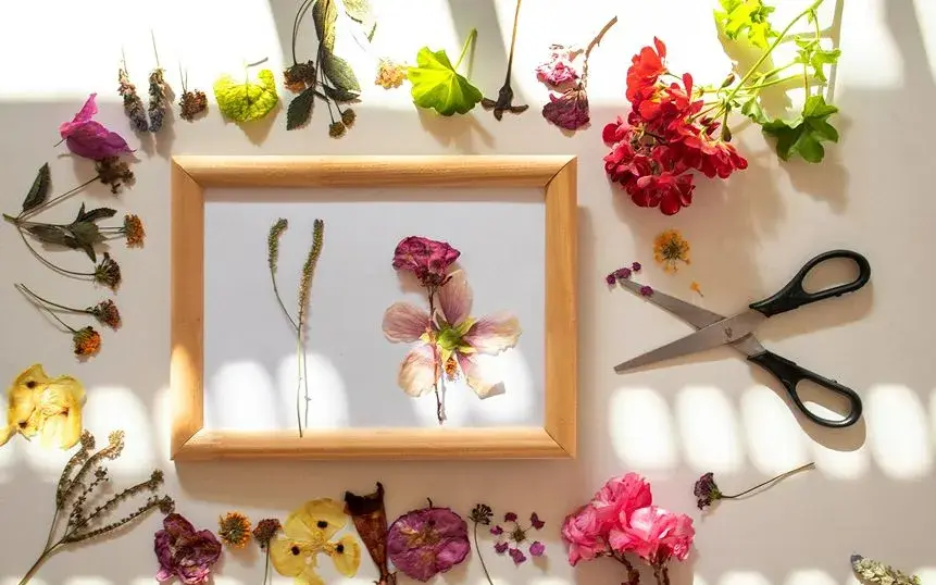 Pressed flowers in a glass frame.
