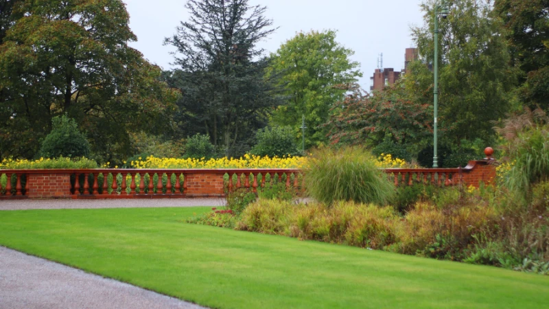 traditional English landscape garden with trees and lawn