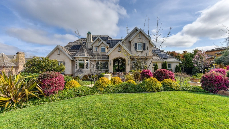 Lush green yard garden with colorful flowering plants